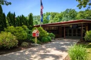 Strategic Seller Pricing: How Braeburn Homeowners Can Maximize Their Returns 1 BraeburnJune2018 1 Braeburn Elementary School a building with a flag pole and a flagpole